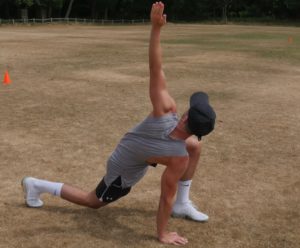 Jack showing the second part for the mobilisation exercise called the greatest stretch in the world.